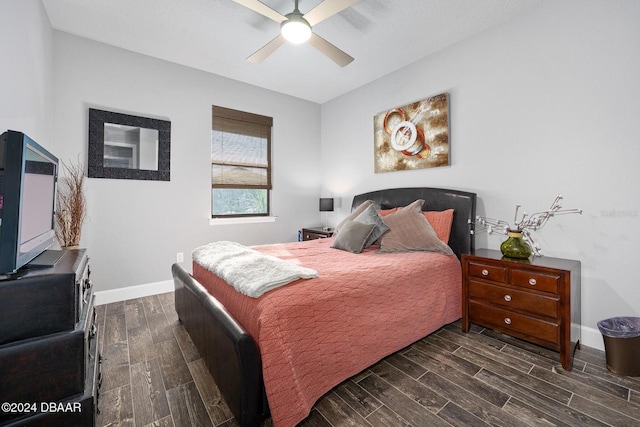 bedroom featuring dark hardwood / wood-style flooring and ceiling fan