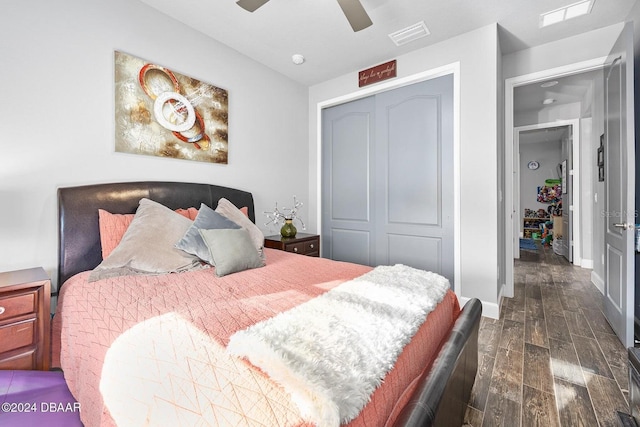 bedroom featuring dark hardwood / wood-style floors, a closet, and ceiling fan