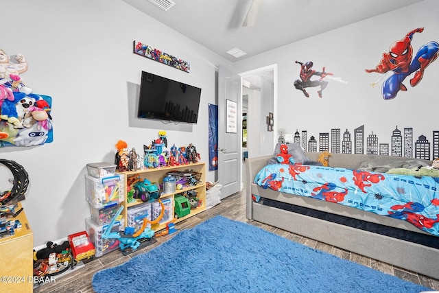 bedroom featuring hardwood / wood-style flooring and ceiling fan