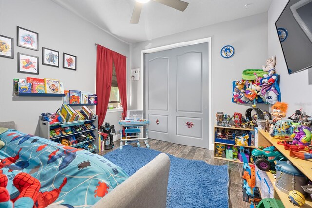 bedroom featuring hardwood / wood-style floors and ceiling fan