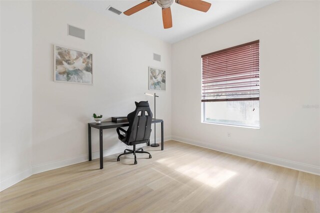 office featuring ceiling fan and light hardwood / wood-style flooring