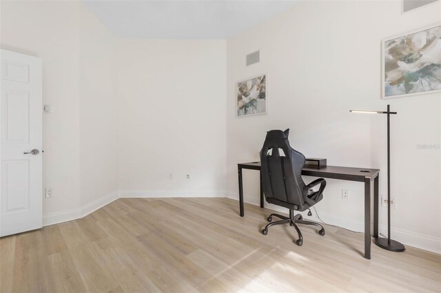 office area with light hardwood / wood-style flooring