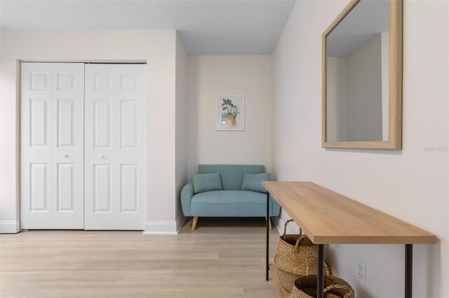 sitting room with light hardwood / wood-style floors