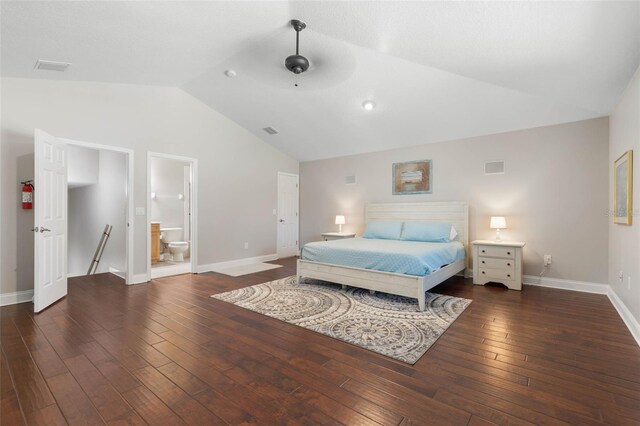 bedroom with vaulted ceiling, ensuite bath, ceiling fan, and dark wood-type flooring