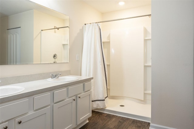 bathroom featuring vanity, wood-type flooring, and a shower with shower curtain