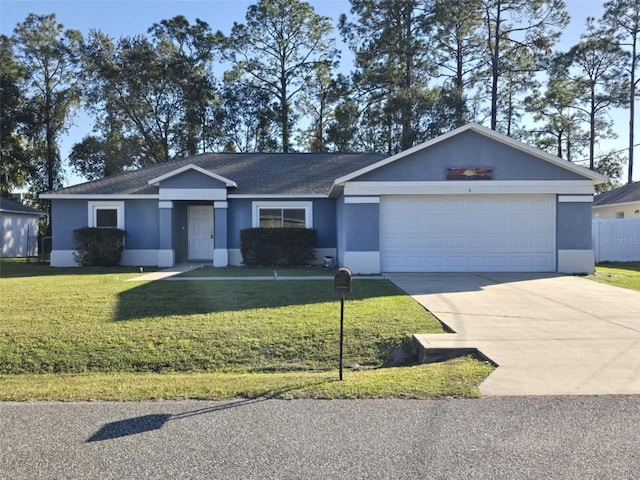 ranch-style house featuring a garage and a front yard