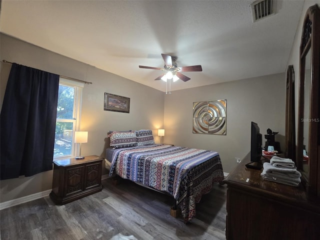 bedroom featuring dark hardwood / wood-style floors and ceiling fan