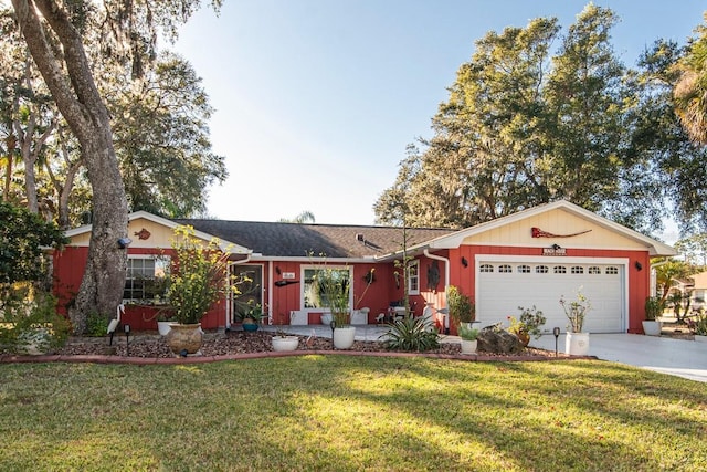 14 Fort Caroline Ln, Palm Coast, FL 32137 - ranch-style house with a garage, a front yard, and concrete driveway
