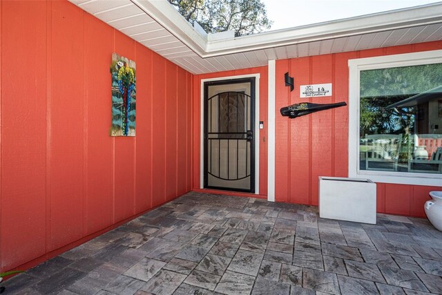 property entrance featuring a patio area