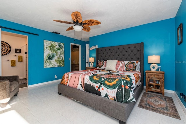 14 Fort Caroline Ln, Palm Coast, FL 32137 - tiled bedroom with baseboards, a ceiling fan, and ensuite bathroom