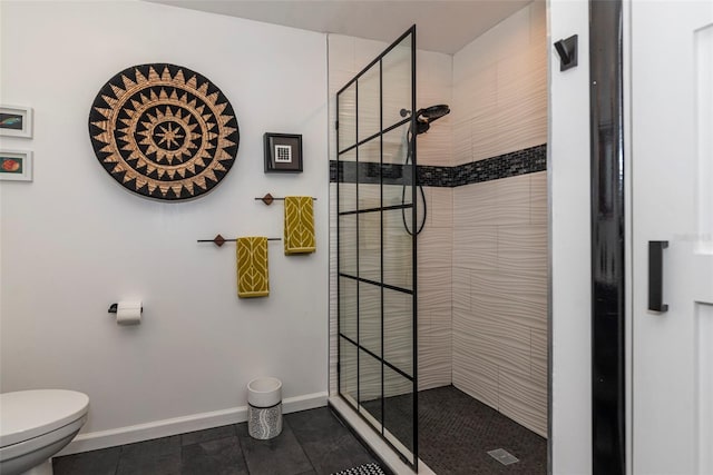 14 Fort Caroline Ln, Palm Coast, FL 32137 - full bath with a tile shower, toilet, baseboards, and tile patterned floors