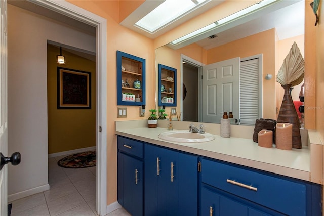 bathroom featuring tile patterned flooring, vanity, and built in features