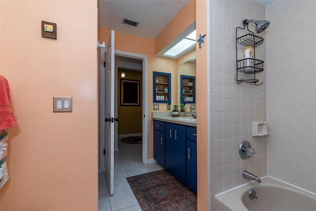 14 Fort Caroline Ln, Palm Coast, FL 32137 - full bath featuring tile patterned flooring, vanity, and shower / bathtub combination