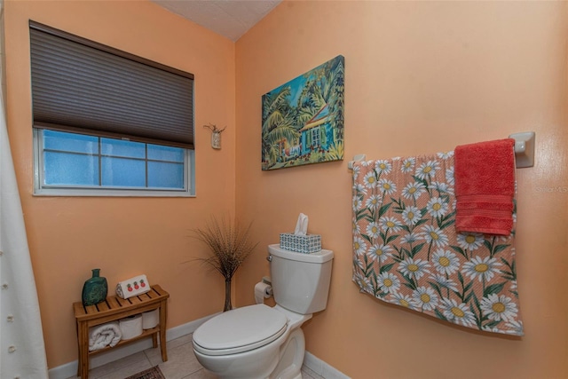 bathroom with tile patterned floors and toilet