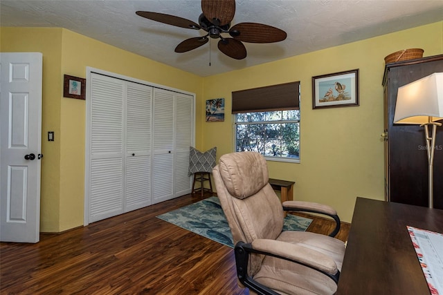 office space with ceiling fan and dark wood-type flooring