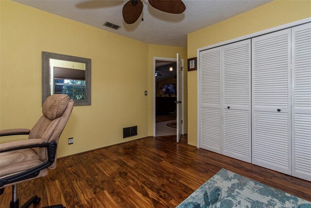 office space with ceiling fan and dark hardwood / wood-style floors