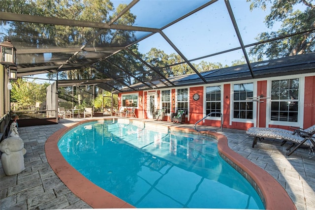 view of pool featuring a lanai and a patio area