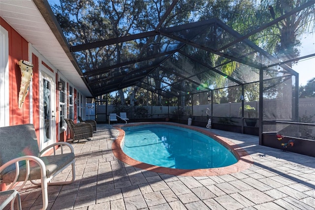 14 Fort Caroline Ln, Palm Coast, FL 32137 - view of swimming pool featuring a patio area, a lanai, a fenced backyard, and french doors