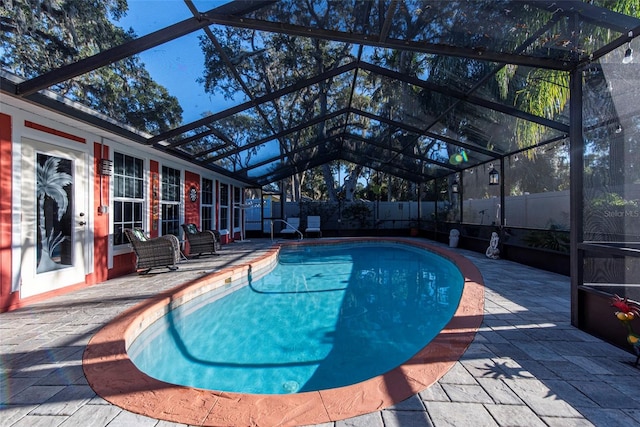 view of pool featuring a lanai and a patio