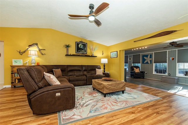 living room featuring hardwood / wood-style floors and lofted ceiling