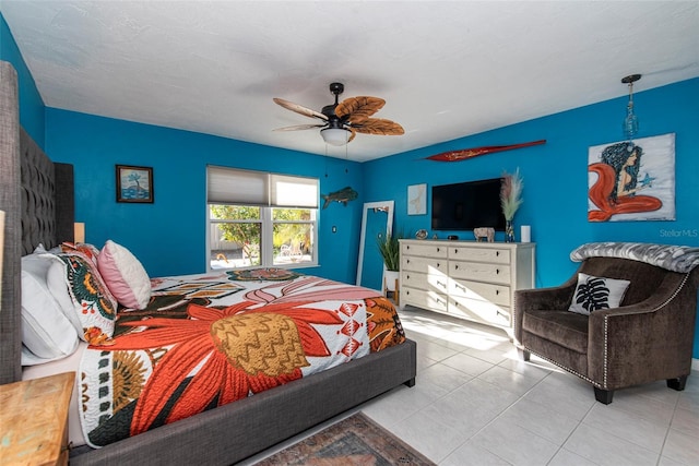 bedroom featuring ceiling fan and light tile patterned flooring