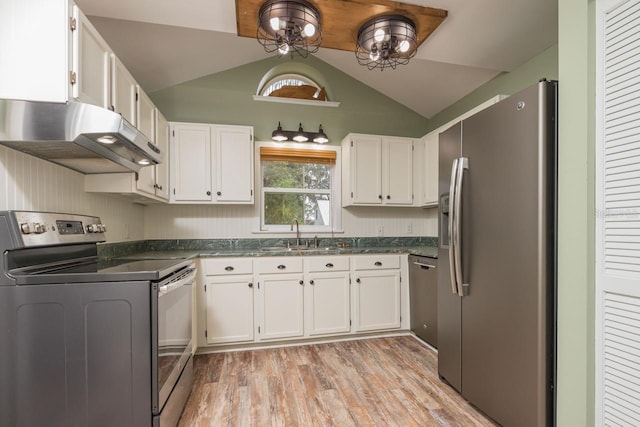 kitchen featuring appliances with stainless steel finishes, sink, light hardwood / wood-style flooring, white cabinetry, and lofted ceiling