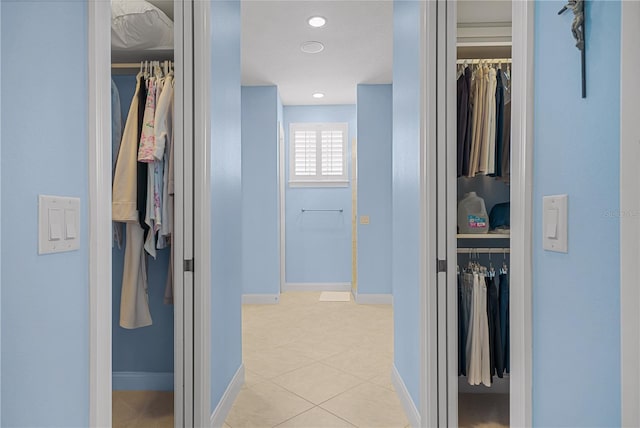 hallway with light tile patterned floors