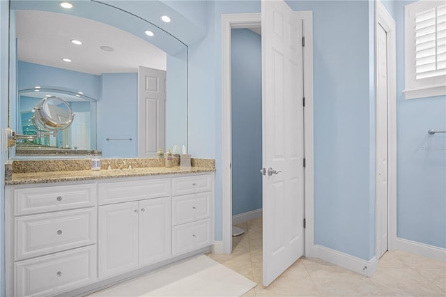 bathroom featuring tile patterned floors and vanity