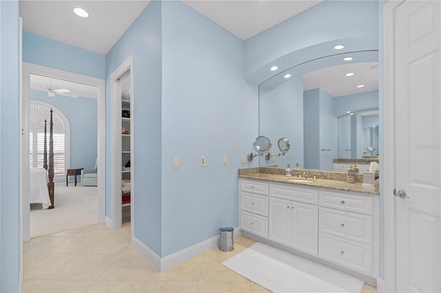 bathroom featuring ceiling fan, tile patterned flooring, and vanity