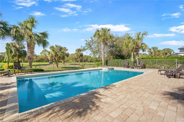 view of swimming pool with a patio