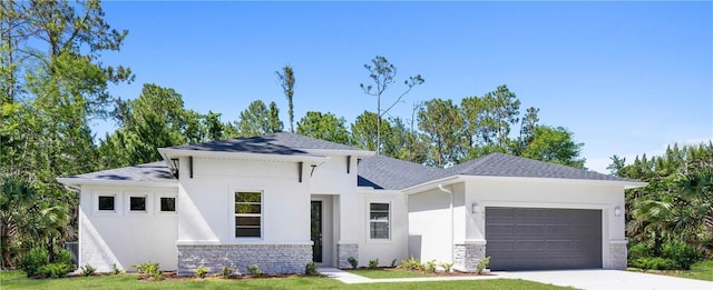 view of front of house with a garage and a front lawn