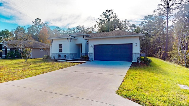 view of front facade featuring a garage and a front lawn