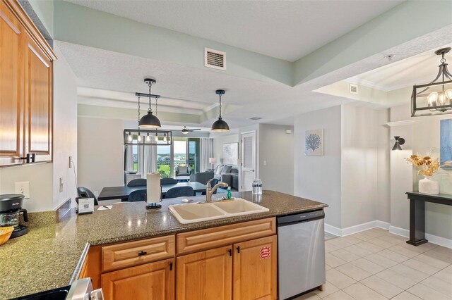 200 Ocean Crest Dr Unit 515, Palm Coast, FL 32137 - kitchen with stainless steel dishwasher, a peninsula, a tray ceiling, hanging light fixtures, and brown cabinetry