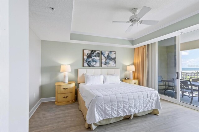 200 Ocean Crest Dr Unit 515, Palm Coast, FL 32137 - bedroom featuring access to outside, wood finished floors, ornamental molding, and ceiling fan