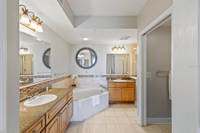 bathroom featuring tile patterned floors, decorative backsplash, separate shower and tub, and vanity