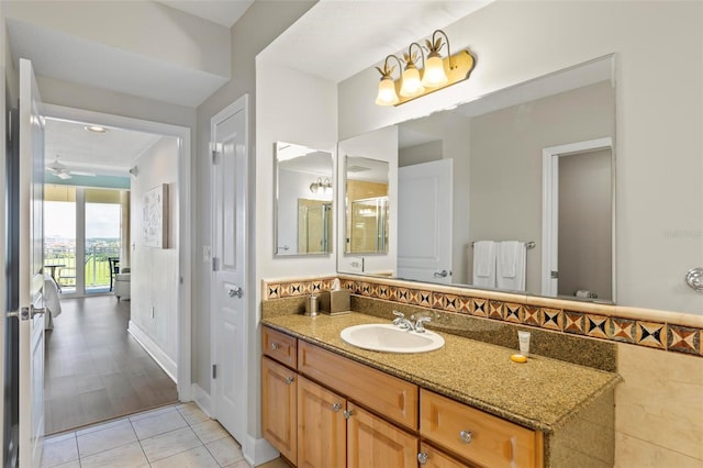 bathroom with vanity, ceiling fan, and wood-type flooring