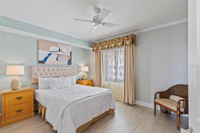 200 Ocean Crest Dr Unit 515, Palm Coast, FL 32137 - bedroom with crown molding, light wood-style flooring, and a ceiling fan
