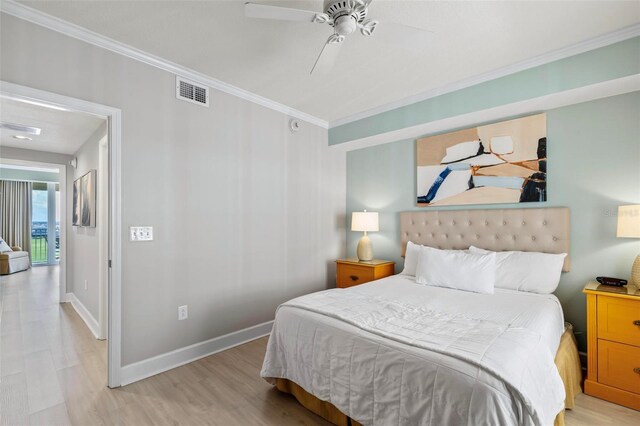 200 Ocean Crest Dr Unit 515, Palm Coast, FL 32137 - bedroom with crown molding, light wood-style floors, and ceiling fan