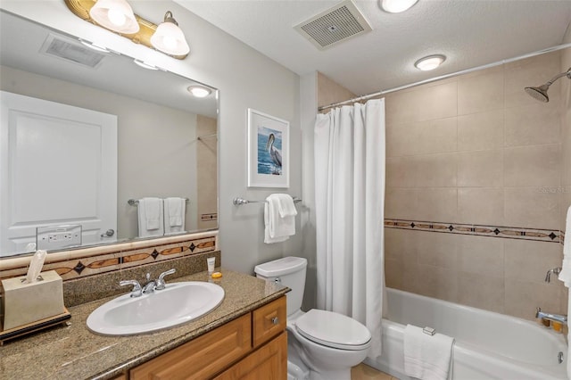 full bathroom with vanity, a textured ceiling, toilet, and shower / tub combo with curtain