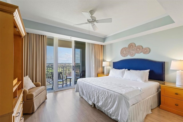 bedroom with access to exterior, ceiling fan, crown molding, and light wood-type flooring