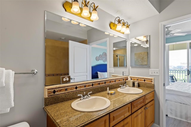 bathroom featuring ceiling fan and vanity