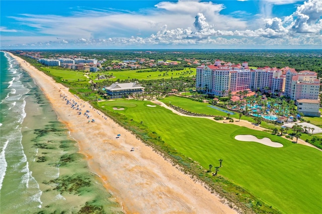 drone / aerial view featuring a view of the beach and a water view