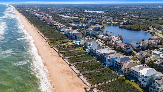 aerial view featuring a water view and a view of the beach