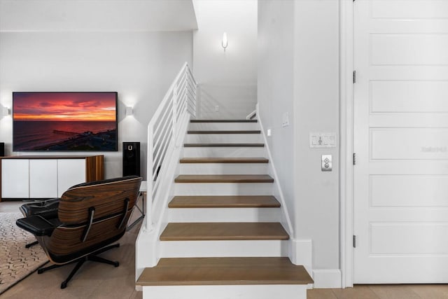 stairs with tile patterned flooring