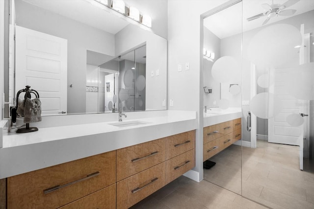 bathroom with tile patterned floors, ceiling fan, and vanity