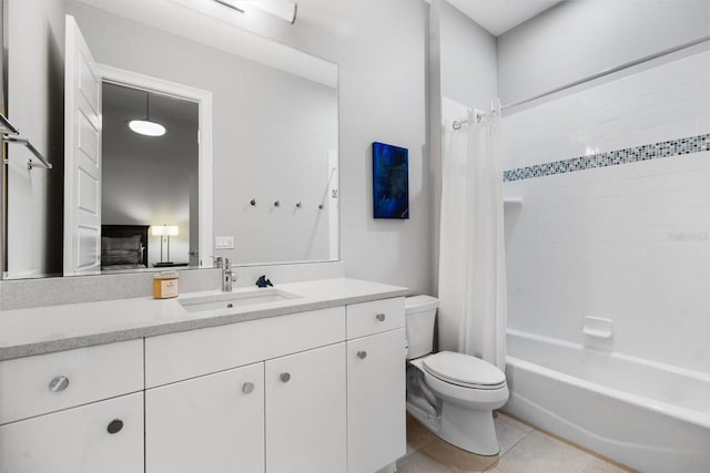 full bathroom featuring tile patterned flooring, vanity, toilet, and shower / tub combo