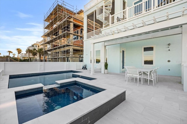 view of pool with a pergola, an in ground hot tub, and a patio