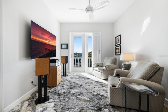 sitting room featuring carpet flooring and ceiling fan