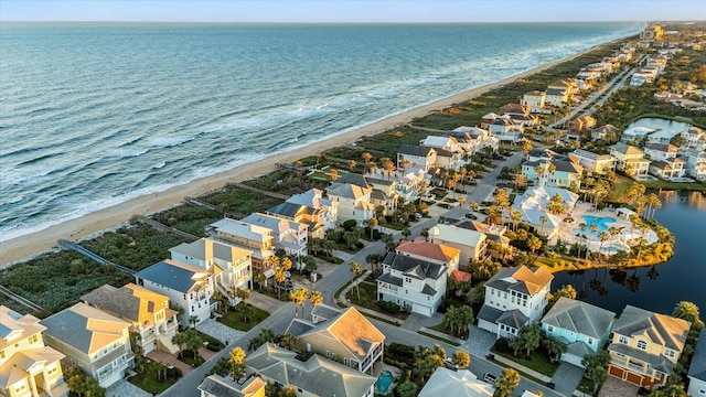 aerial view featuring a view of the beach and a water view