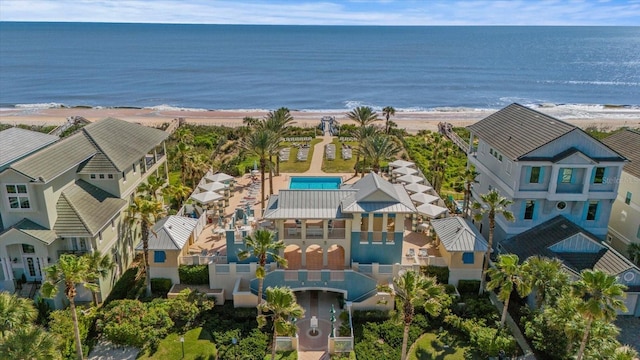 drone / aerial view with a water view and a view of the beach